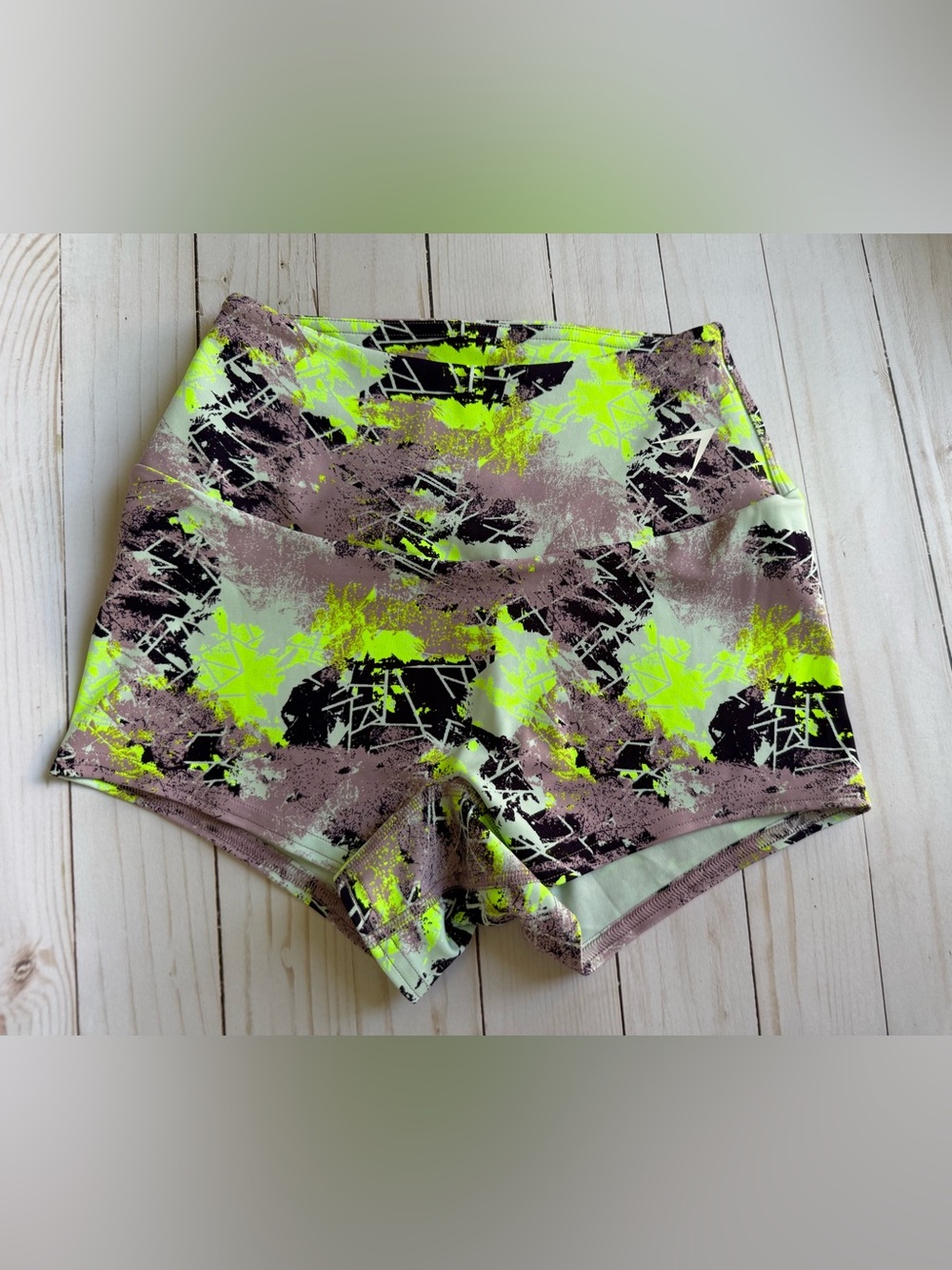 Gymshark Quad training shorts neon green, grey, and black abstract camo pattern.